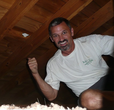 The author in the attic of the impacted home