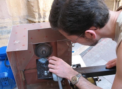 Marcin Cimala cutting a lunar meteorite